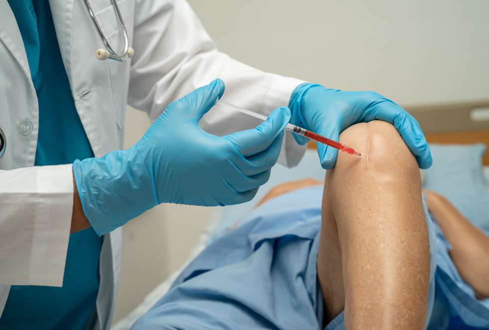 PRP injection being administered into the knee at Health Builders in Annandale
